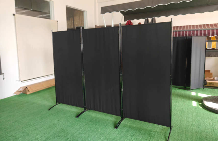 Three-panel fabric room divider in showroom